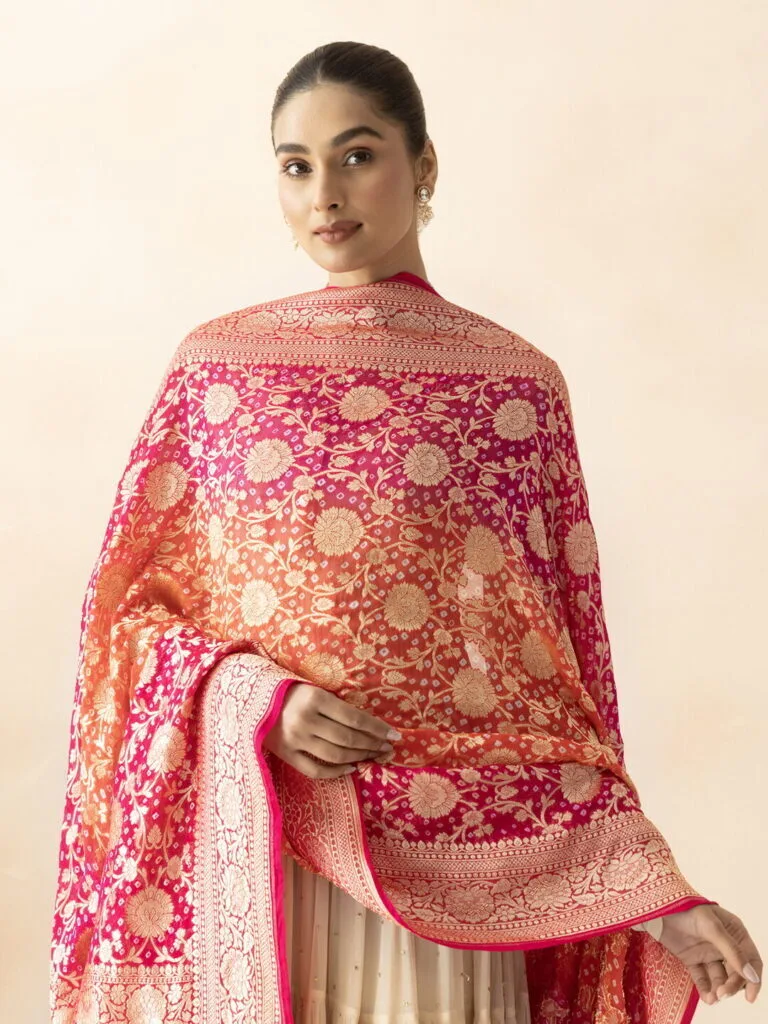 Beautiful pink embroidered saree with intricate gold floral patterns, perfect for weddings and festi.